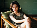 Young woman relaxing in wooden armchair with natural light