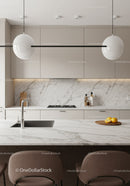 Elegant White Kitchen with Marble Backsplash and Pendant Lights
