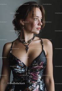Elegant Young Woman Wearing Jewelry and Floral Dress in Studio