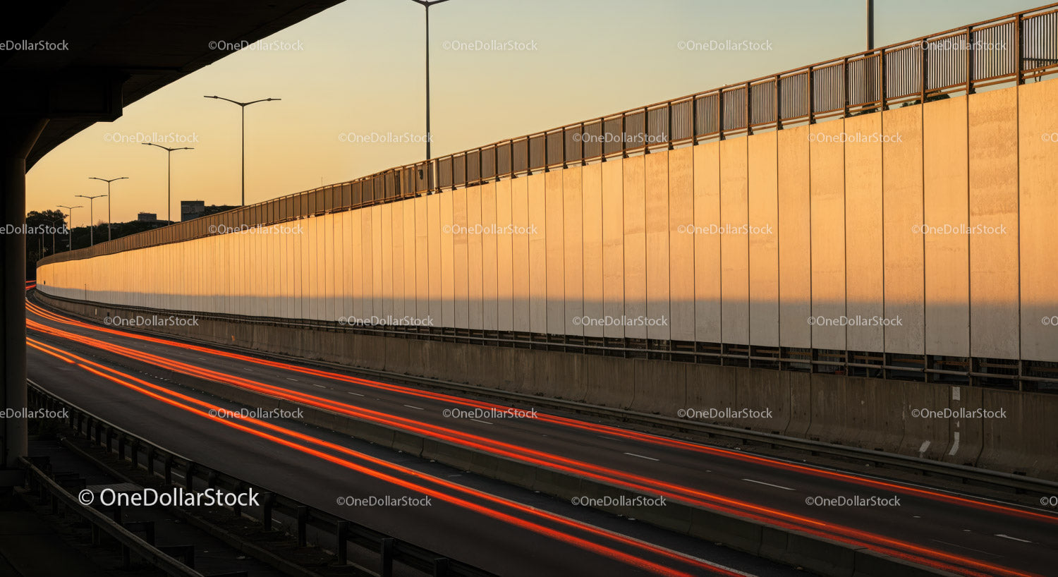 Sunset Scene of Urban Highway with Light Trails and City Skyline
