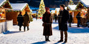 Couple chatting warmly at festive winter market night