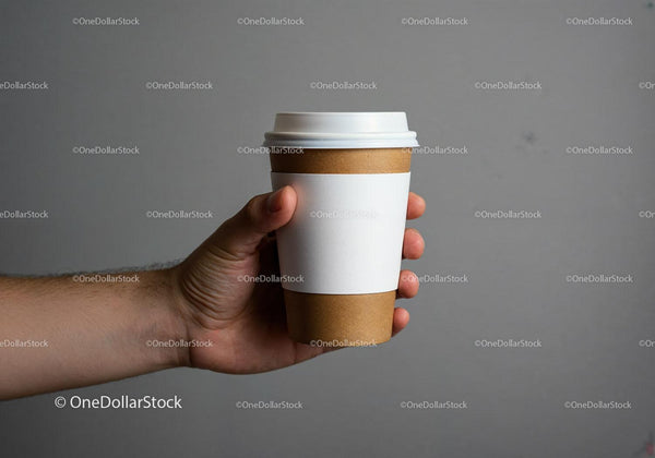 Hand Holding Disposable Coffee Cup with Sleeve JPG Mockup Image