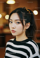 Stylish Asian Woman with Winged Eyeliner in Black White Sweater