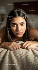 Close-up of Young Woman with Brown Eyes and Hair Clips in Cozy Home Setting