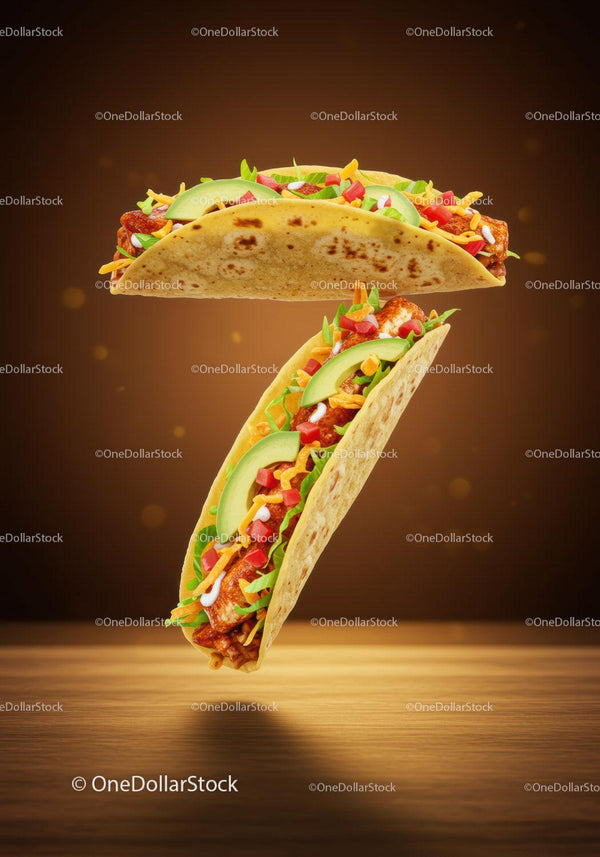 Two flavorful tacos with fresh vegetables and cheese