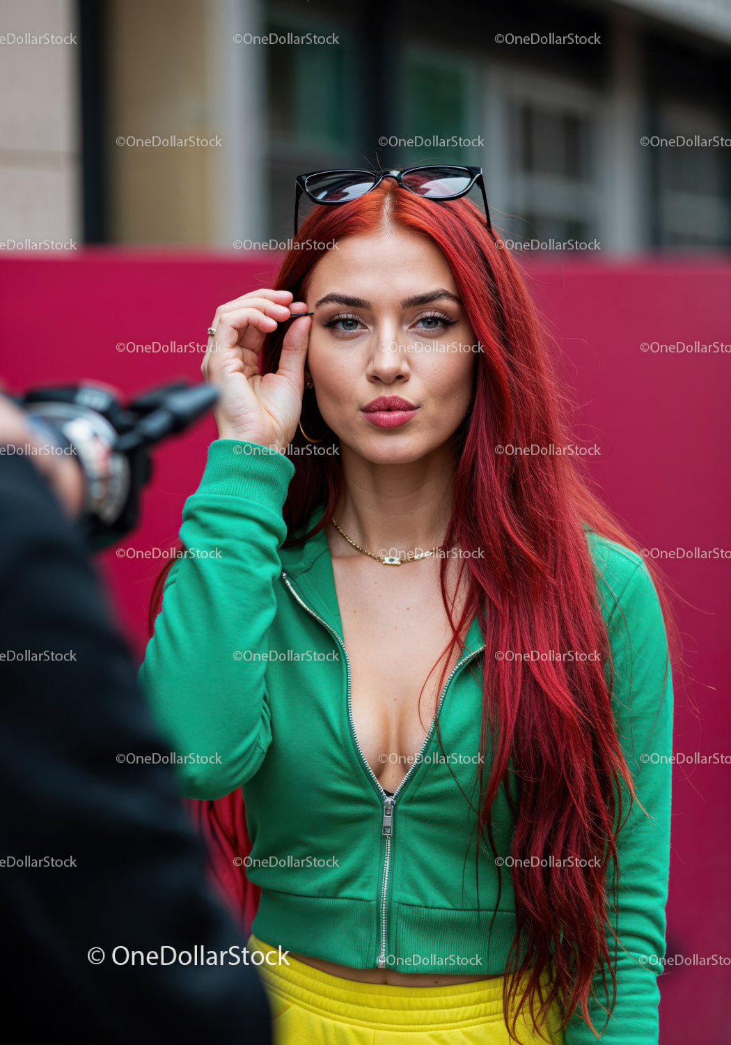 Vibrant Red Hair Woman in Green Tracksuit with Sunglasses in City