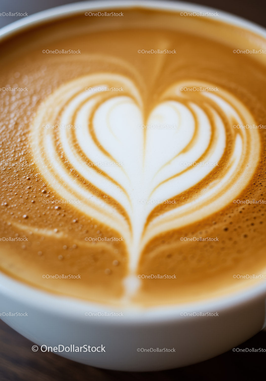 Close up of latte art heart in white coffee cup