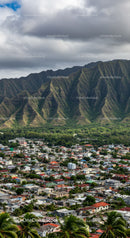 Mountain Range Overlooking a Tropical Coastal City with Residential Homes
