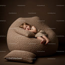 Sleeping toddler resting on a textured brown beanbag chair