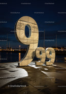 Illuminated Sculpture of Number 999 at Night Harbor