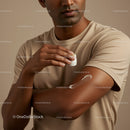 Man Applying Lotion on Arm in Close-Up for Skin Moisturization