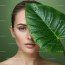 Young Woman with Blue Eyes and Green Leaf in a Natural Beauty Portrait