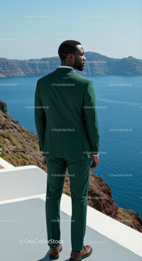 Man in Green Suit Overlooking Scenic Blue Ocean View