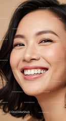 Close-up portrait of joyful young woman smiling warmly