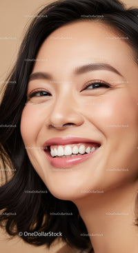 Close-up portrait of joyful young woman smiling warmly
