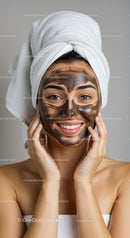 Girl with Facial Clay Mask and Towel Wrap in Spa Setting