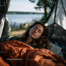 Tranquil Woman Sleeping in Tent by Lake During Camping Trip