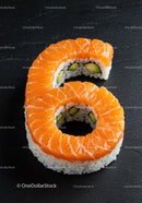 Salmon Sushi Roll Shaped As Number Six On Black Slate