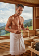 Middle-Aged Man Enjoying Sauna Spa Relaxation in Wooden Cabin