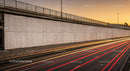 Moving Vehicle Light Trails on Highway During Sunset