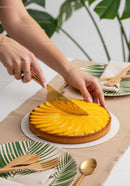 Fresh Mango Peach Tart with Sliced Fruit on Elegant Table Scene