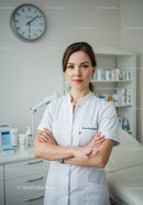 Female Dentist Standing Confidently in Modern Dental Office