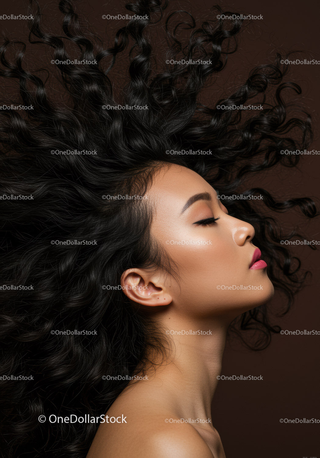 Profile of serene woman with flowing curly hair