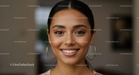Young Woman Smiling Portrait with Elegant Earrings and Natural Makeup