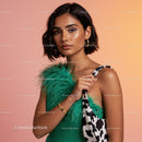Young Woman in Green Dress with Feather Accent and Cropped Hair