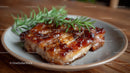 Grilled Chicken Thigh with Rosemary on a Rustic Plate