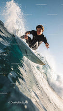 Focused surfer riding a powerful wave in clear ocean