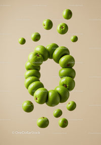 Fresh green apples arranged in circular floating pattern