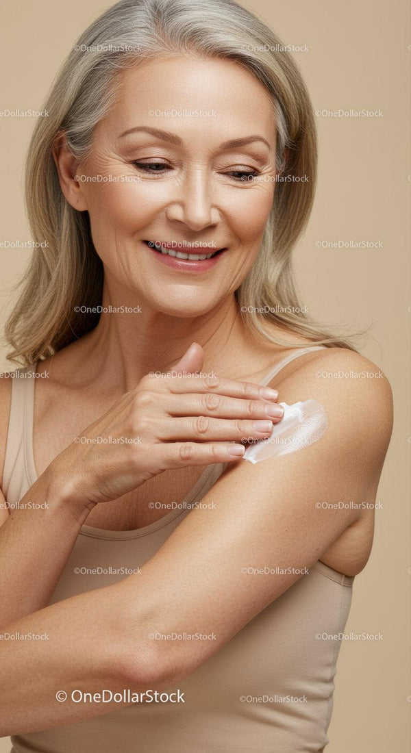 Elegant Elderly Woman Applying Moisturizer with a Gentle Smile