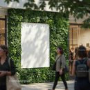 Urban greenery framing blank advertisement panel in shopping area