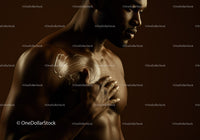Artistic Portrait of a Muscular Man Showing Reflection and Strength