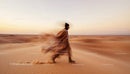 Woman Dancing in a Flowing Dress on Golden Desert Sands
