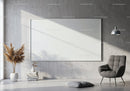 Minimalist living room with gray armchair and wall art