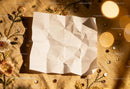 Wrinkled white paper on embroidered fabric with sequins JPG Mockup Image preview