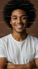 Smiling Young Man with Curly Hair in Casual T-Shirt