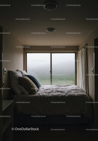 Cozy Bedroom with Rainy Window and Soft Lighting