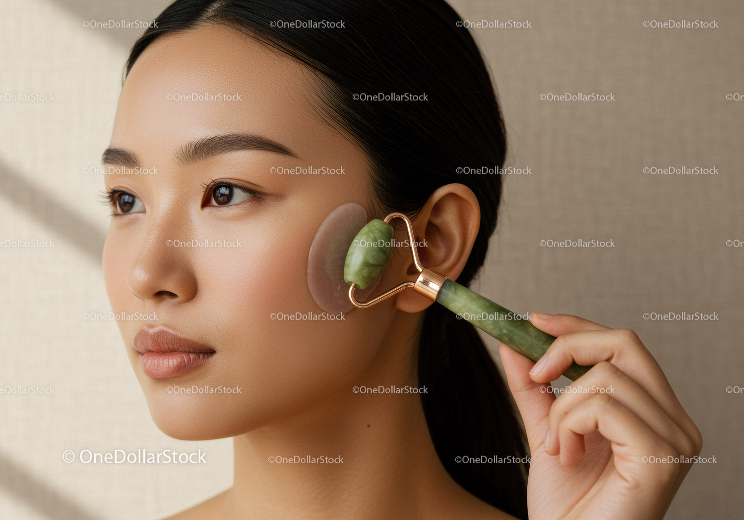 Woman Using Jade Roller for Facial Massage and Skin Care