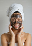 Young Woman with Facial Mask and Towel Wrap in Spa Setting