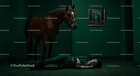 Woman Lying on Floor Beside a Horse in Dramatic Green Room