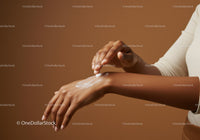 Elegant Hands Applying Moisturizing Lotion Against Warm Brown Background