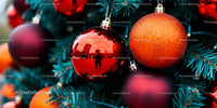 Close-up of Vibrant Red and Orange Christmas Ornaments