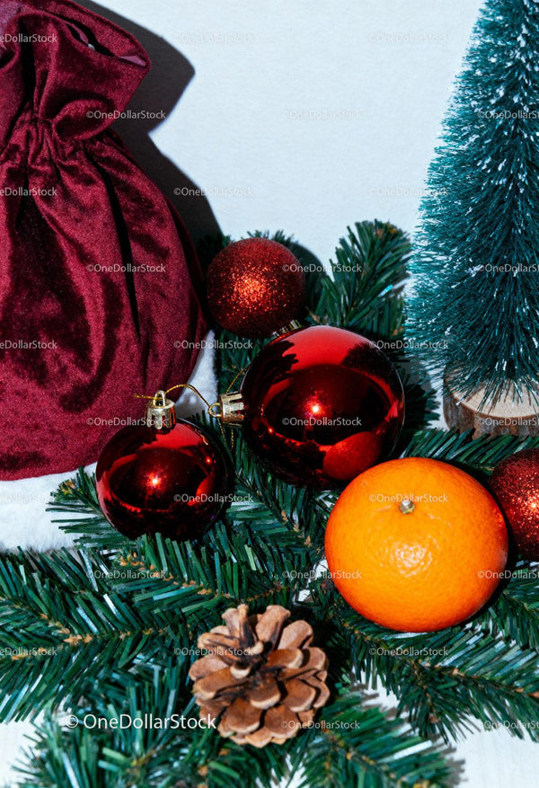 Festive Christmas decorations with pinecone and orange