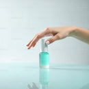Elegant Hand Holding Turquoise Nail Polish Bottle in Minimalist Style