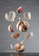 Floating garlic cloves and peels in mid air with gray background