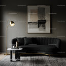 Modern living room with black velvet sofa and gold lamp