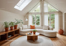 Bright modern living room with curved sofa and plants